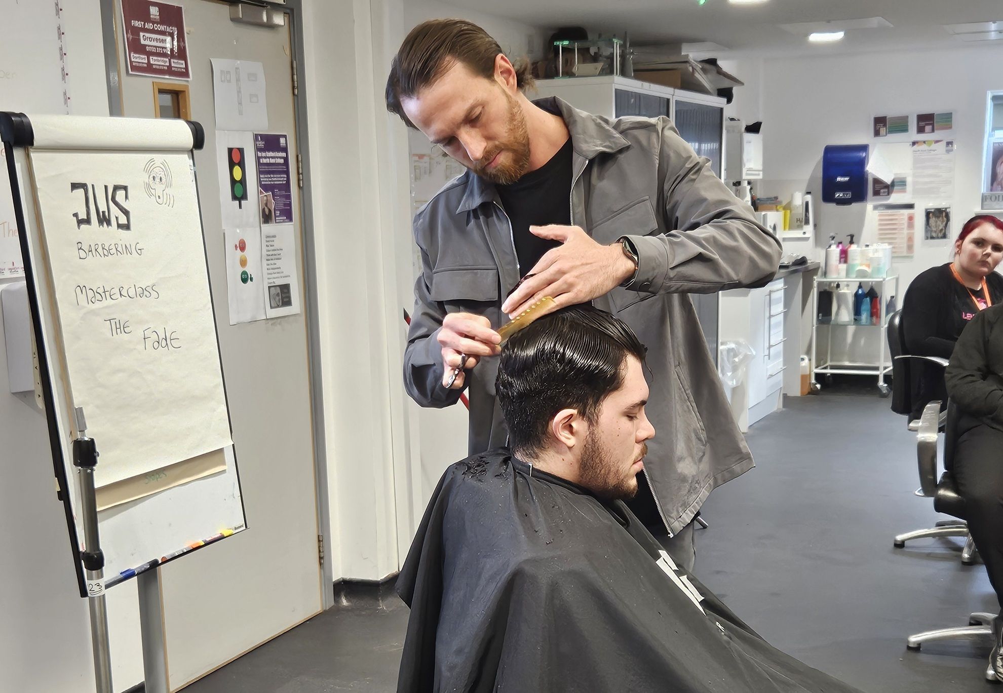 Man cutting man's hair