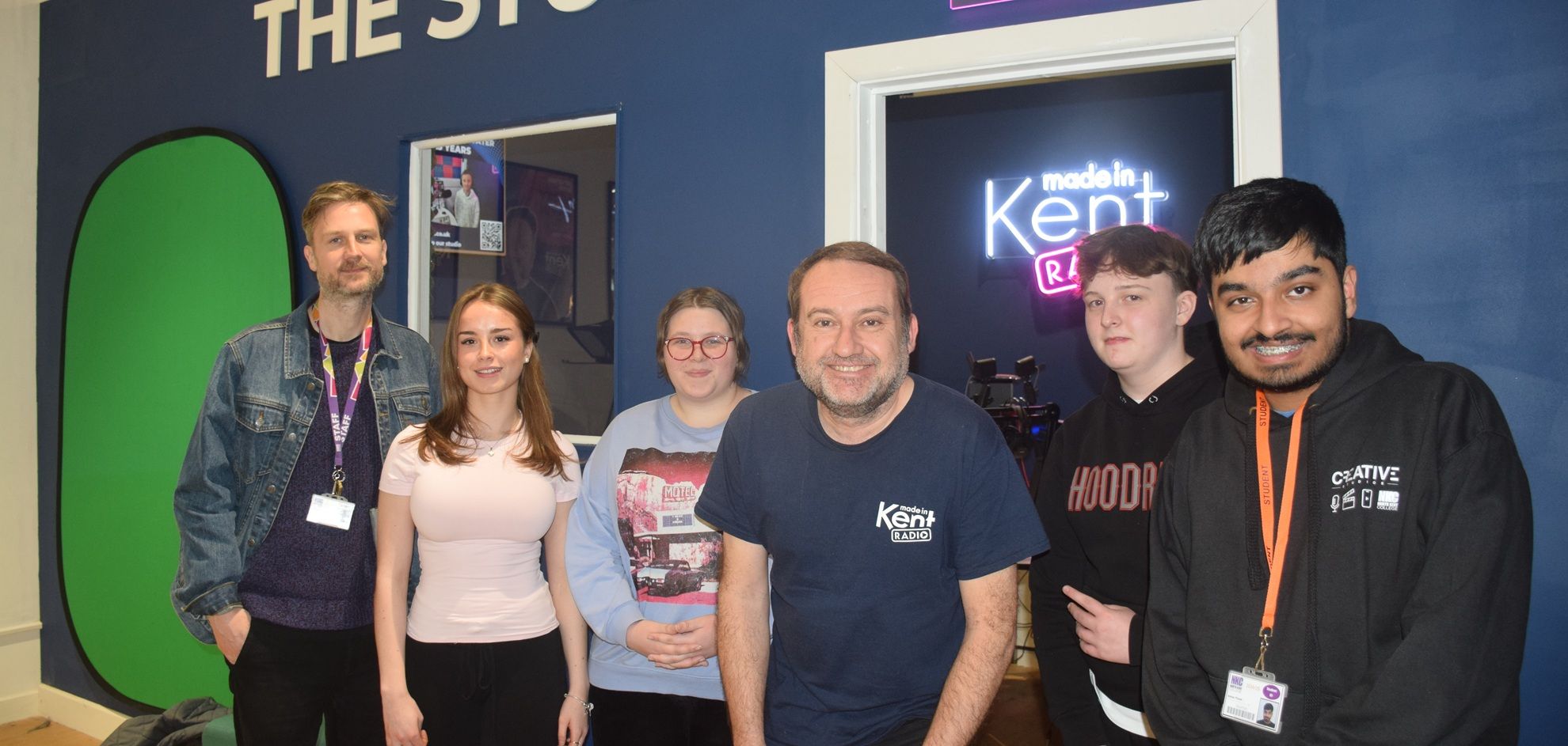 Students and lecturers outside radio studio